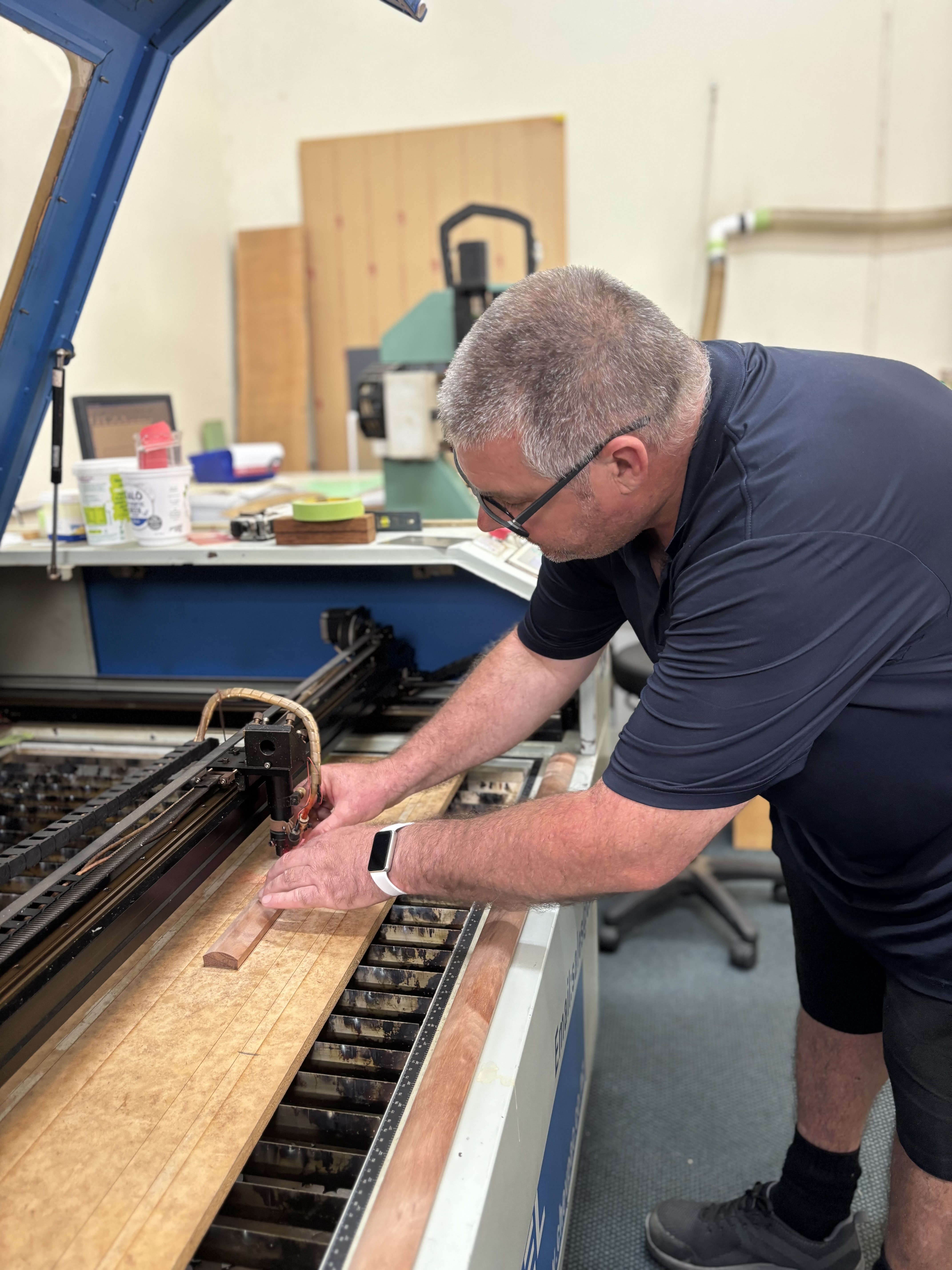 Warkworth Engravers owner Murray Hill setting up the process for etching the battens
